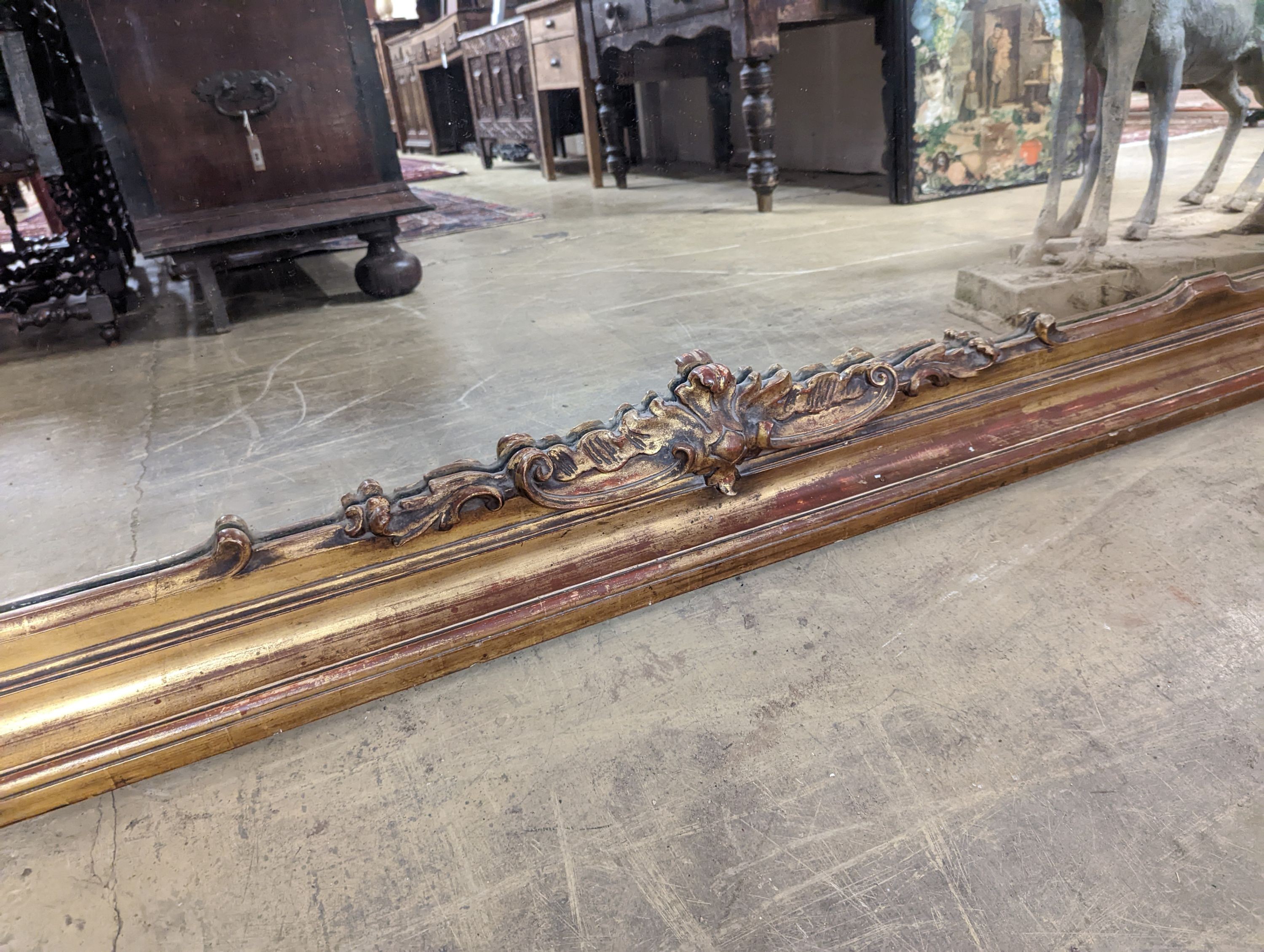 A large Victorian gilt framed landscape overmantel mirror. W-260cm, D-11cm, H-96cm.